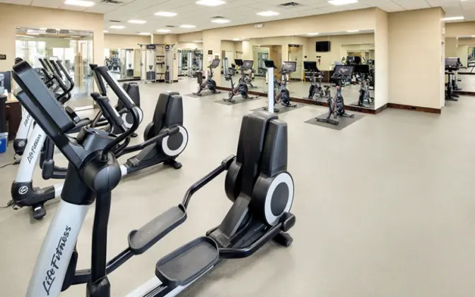 Gym inside the Florida Mall featuring cardio equipment in a large open room.