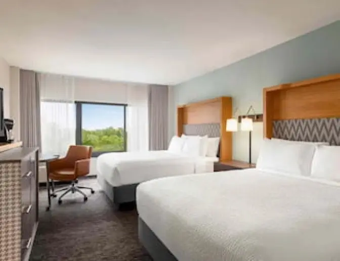 A room that has two Queen beds at the Holiday Inn Orlando International Airport hotel.