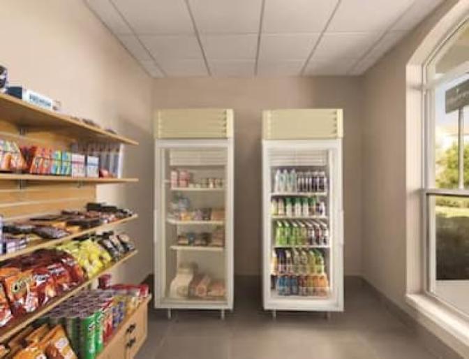 Country Inn & Suites near Orlando Airport, market featuring refrigerated beverages and a vast array of snacks.