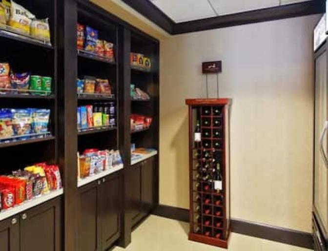 Homewood Suites by Hilton near Orlando International Airport market featuring a large display of grab and go snacks.
