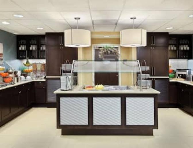 Buffet style kitchen area featuring a cold breakfast station and a warm breakfast station.