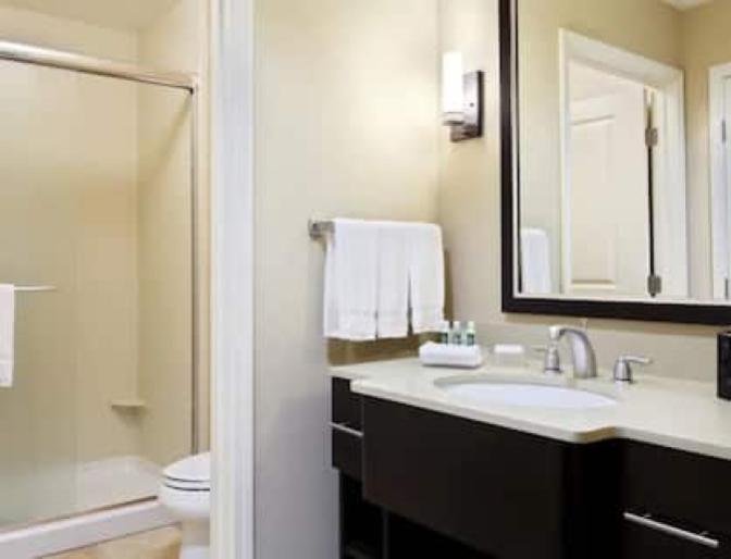 Bathroom inside a guest bedroom featuring a large walk in shower.