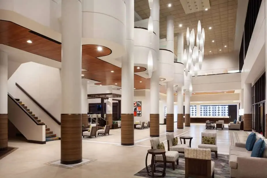 Grand lobby of Marriott Lakeside Orlando International Airport Hotel with open seating areas, large pillars, and sophisticated design elements.