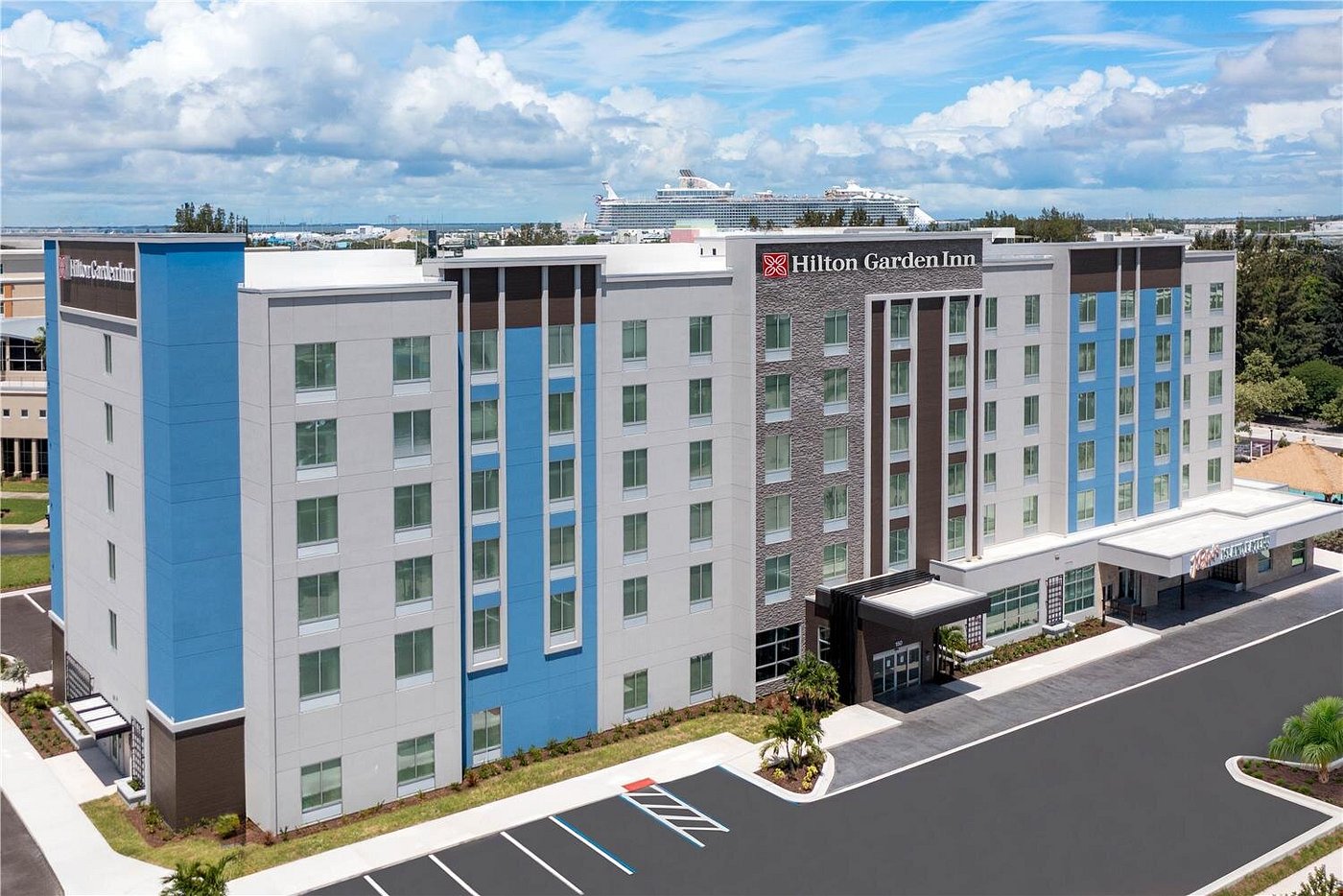 Exterior view of Hilton Garden Inn Cape Canaveral near Cocoa Beach, featuring modern architecture close to Port Canaveral.