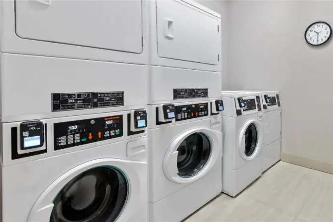 Guest laundry room with washers and dryers available at Hilton Garden Inn Cape Canaveral near Cocoa Beach.