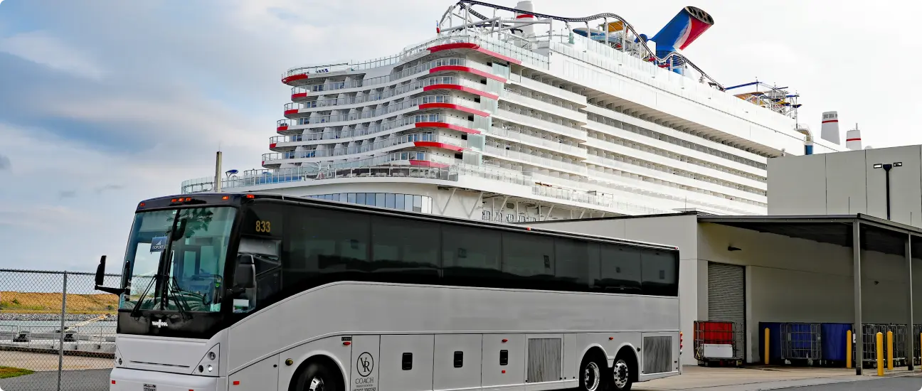 Go Port shuttle bus parked near a Carnival cruise ship at the terminal, ready to transport passengers